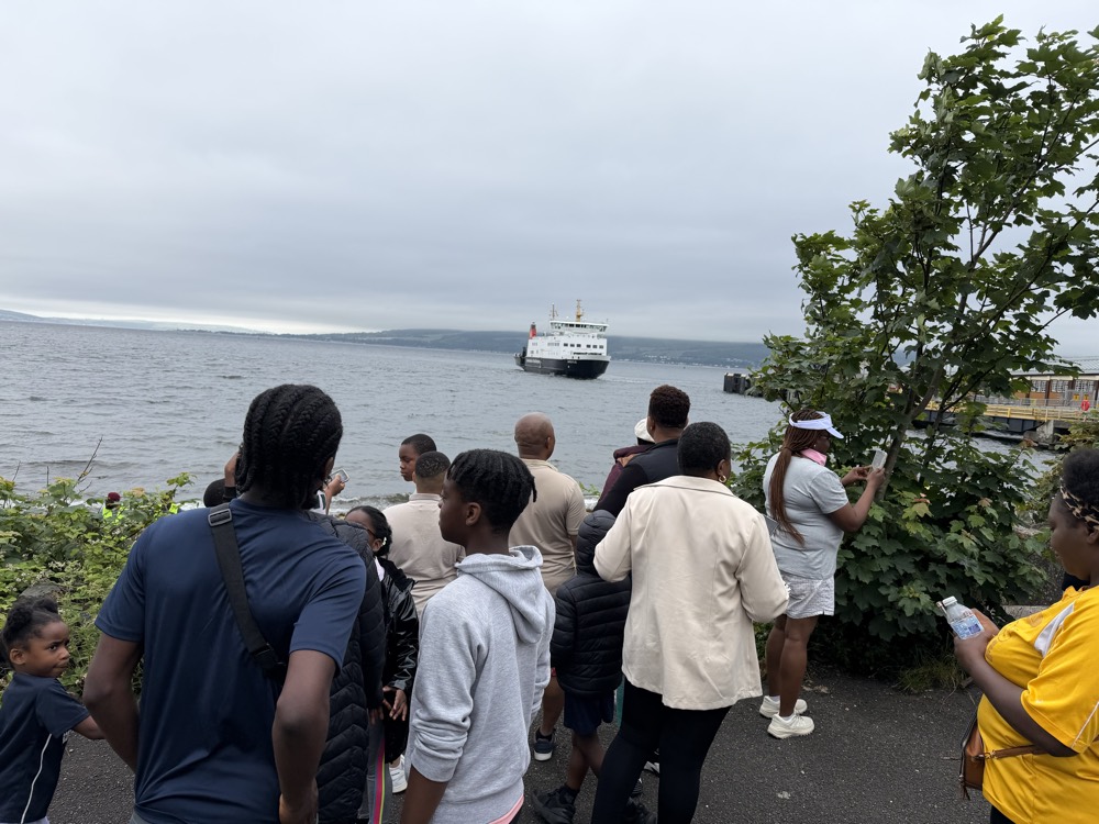 Members watching the Rothesay ferry from the shore path