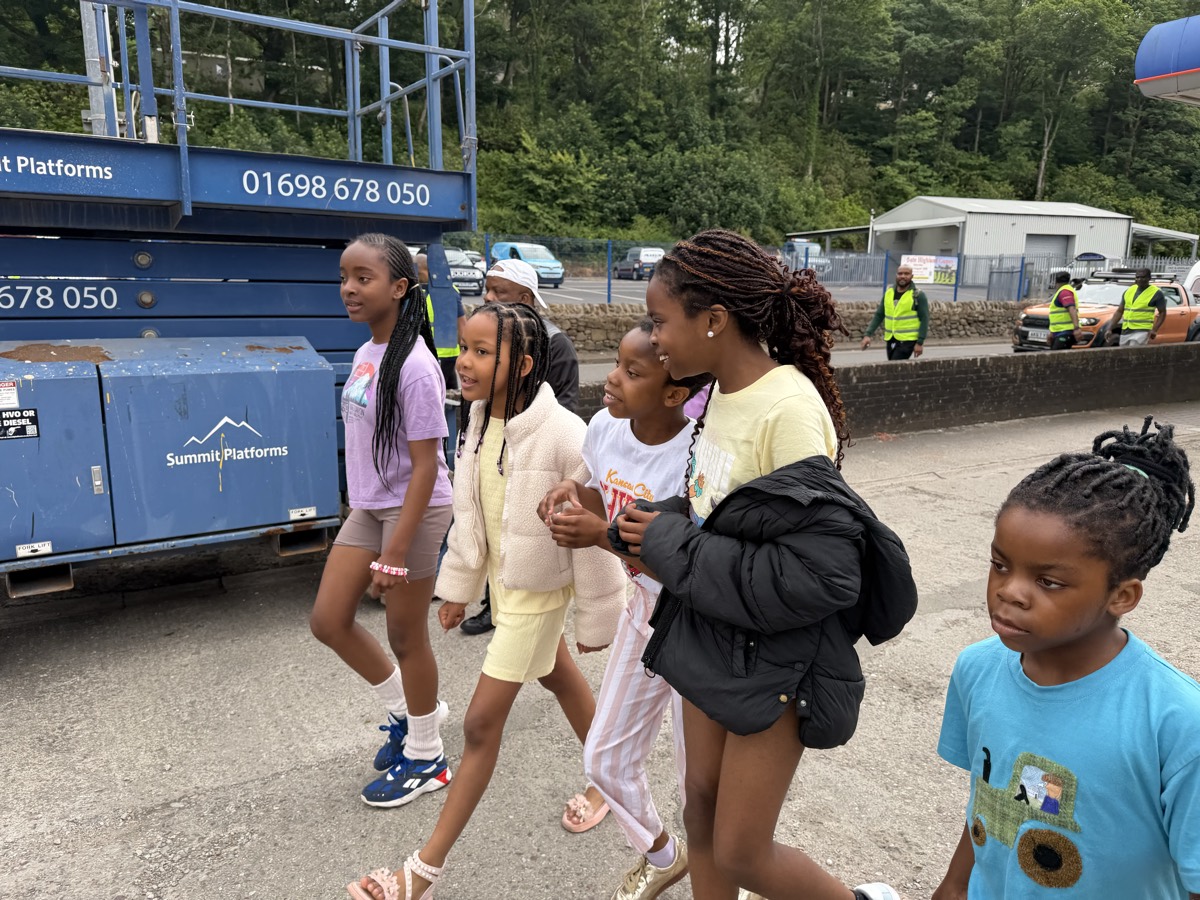 Children walking together through the village